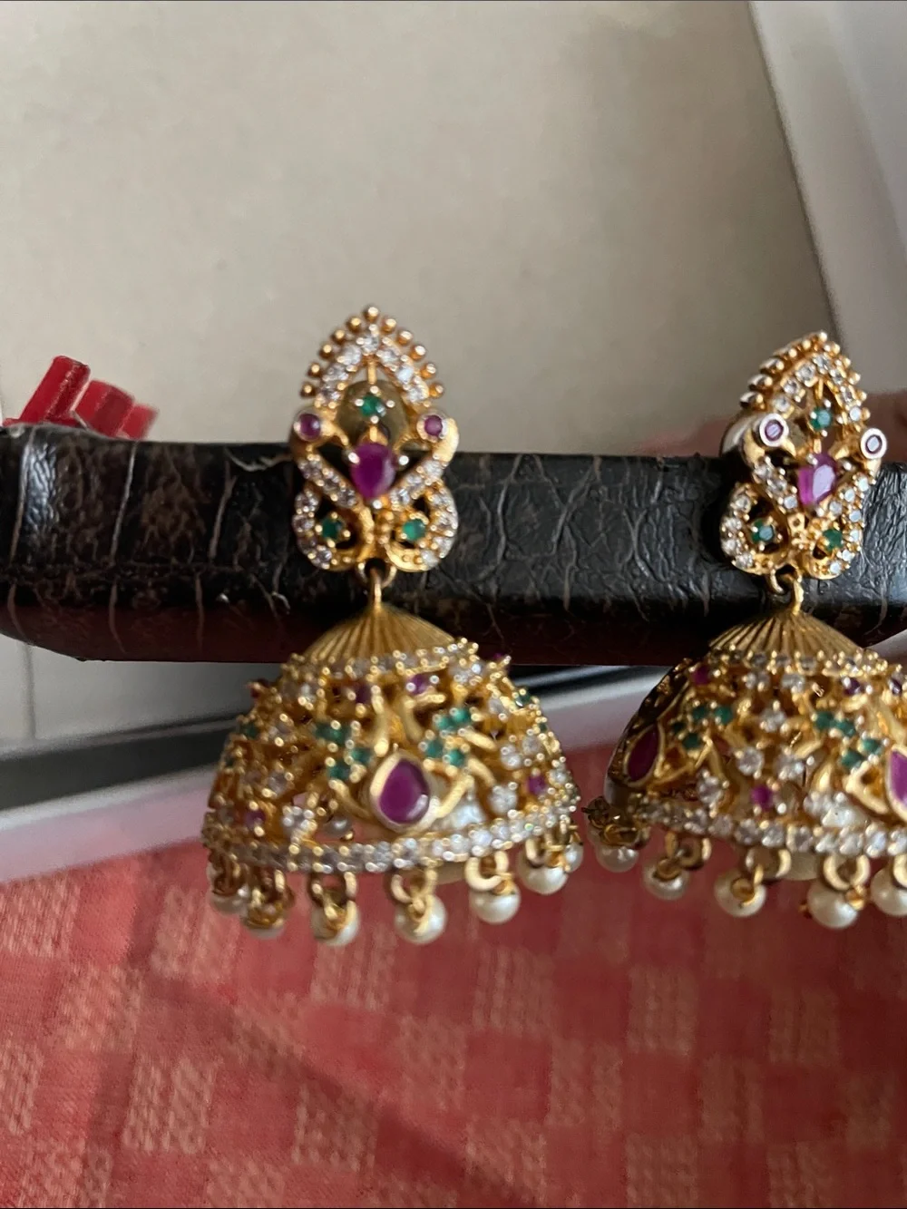 Gold Jhumka Earrings with Purple and Green Stones